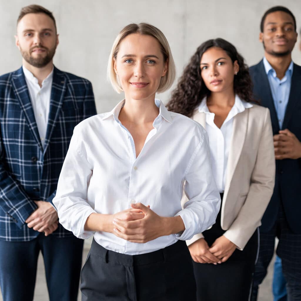 Standing In Front Of Business Team In Office